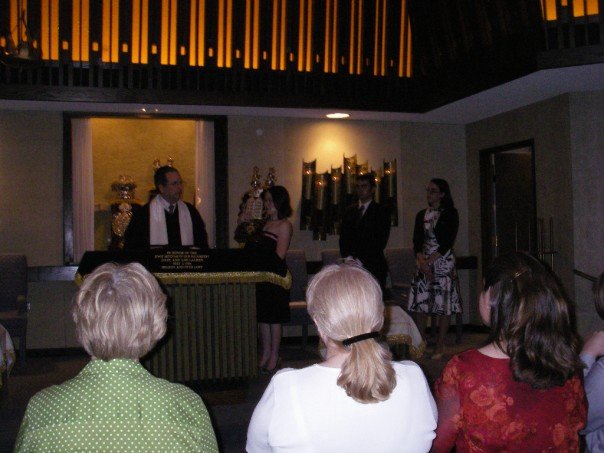 Torahs are really heavy.  I don't recommend strapless dresses.